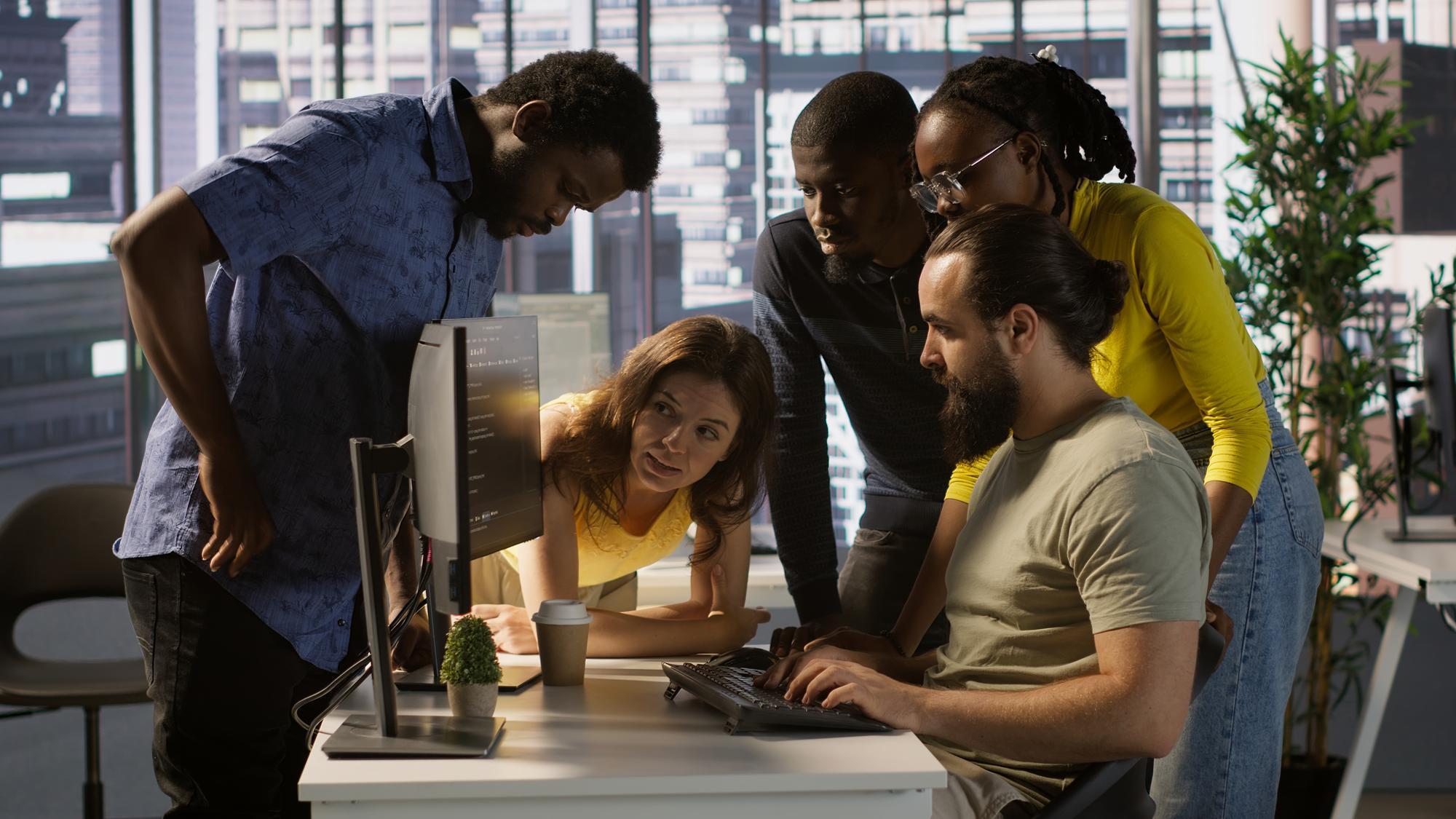 PURE LAMBDA - Team of developers doing brainstorming and optimizing code